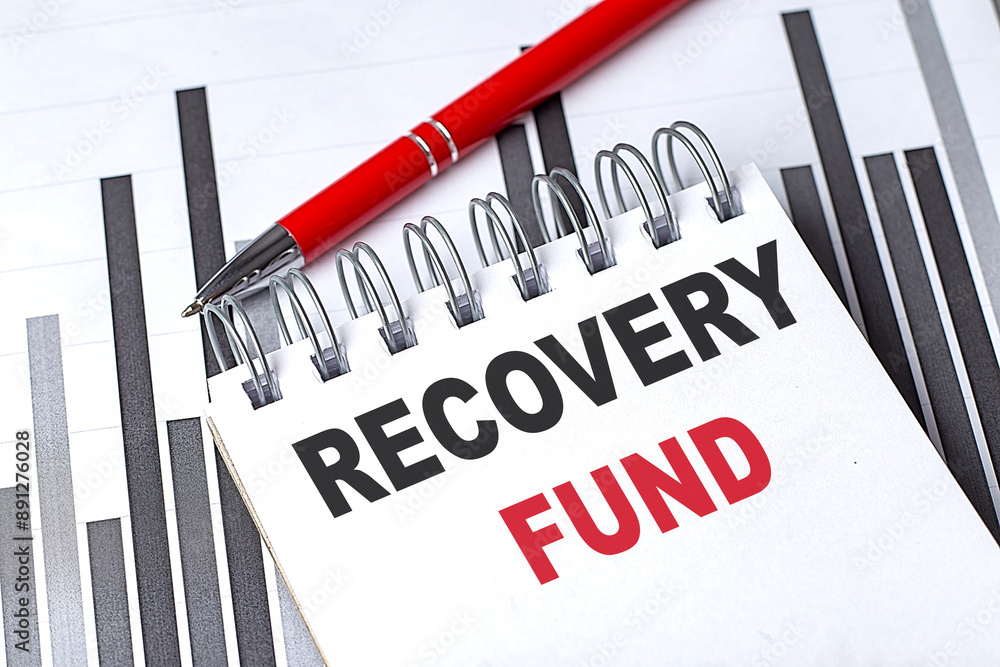 Aufkleber recovery fund text on notebook on chart with pen