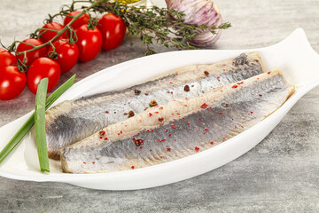 Marinated herring fillet with green onion