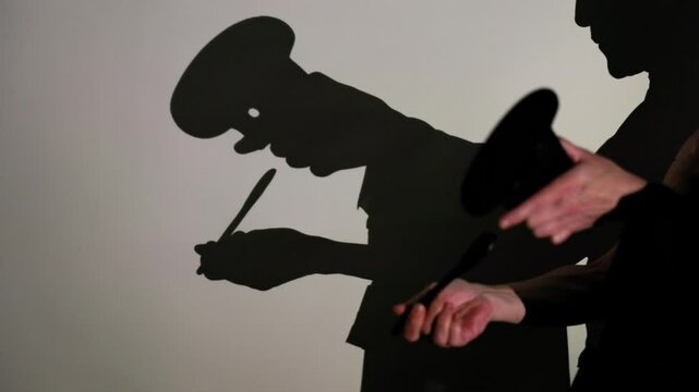Captivating shadow puppets storytelling scene with intricate hand movements and props on a blank wall, depicting a mysterious narrative