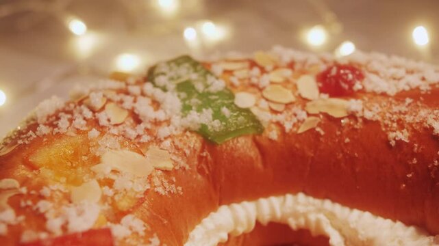 Traditional spanish round cake Roscon de Reyes with fruit and nuts.