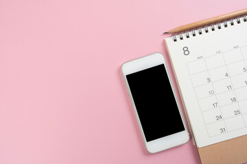 close up of calendar and smart phone on the pink table background, planning for business meeting or...