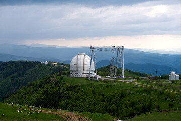 Large observatory dome with a metal crane structure.