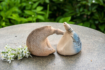 still life with decorative earthenware on a background of green plants, handmade, artisan concept, interior items,  decor