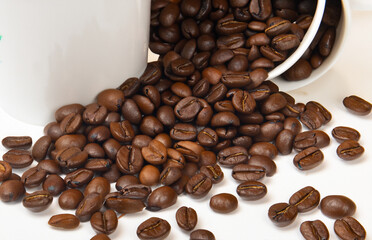 some coffee beans and a cup of coffee