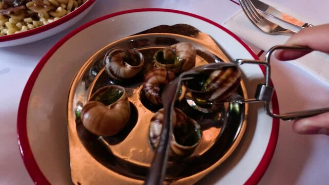 Eating Escargot in Paris Restaurant