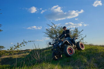 active recreation on a quad bike, off-road riding on a quad bike, leisure time on weekends in nature © retbool