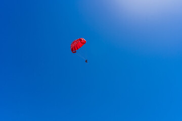 paragliding in the blue sky