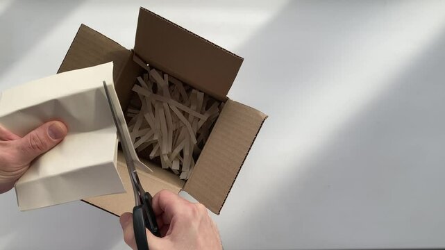 cutting paper with scissors. paper. A4 paper. Slow motion video. High-quality 4K shooting