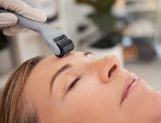 Spa, relax and woman with derma roller for facial, skincare and mesotherapy treatment for anti...