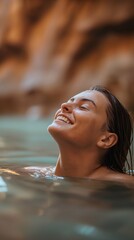 Fototapeta premium A beautiful woman soaking in the Virgin River in the Narrows in Zion National Park in Utah / Summertime holiday in nature in a natural spring