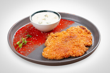 Chicken schnitzel with blue cheese sauce and paprika