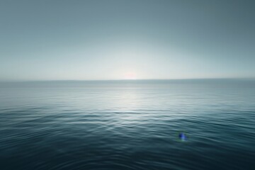 Obraz premium A tranquil scene of the ocean blended seamlessly into a soft, hazy horizon, capturing the calmness of the sea under a gentle, overcast sky, evoking peace and tranquility.