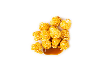 Sweet caramel popcorn isolated on white background. Salted caramel popcorn. Caramel sauce. Close up. Topping.