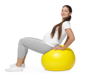 Beautiful pregnant woman doing exercises on fitball against white background © New Africa