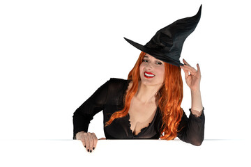 Witch on Halloween Female wizard fairy character for All Saints' Day. Fantasy gothic red-haired Vampire girl in black dress carnival costume.