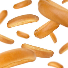 Fresh hot dog buns in air on white background