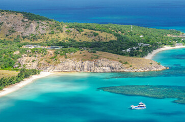 Picturesque aerial view on tropical sandy Watsons Beach with turquoise water on Lizard Island, Australia. Lizard Island ¬†is located on Great Barrier Reef in north-east part of Queensland.