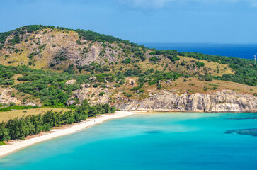 Picturesque aerial view on tropical sandy Watsons Beach with turquoise water on Lizard Island, Australia. Lizard Island  is located on Great Barrier Reef in north-east part of Queensland.