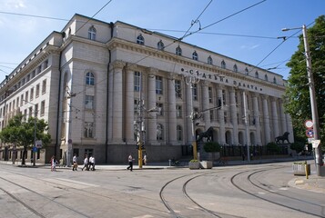 Sofia, Bulgaria - Jul 7, 2024: Sofia City Court. People walking in Ancient Serdica. Streets and buildings. Lifestyle in the urban area. Sunny day. Selective focus