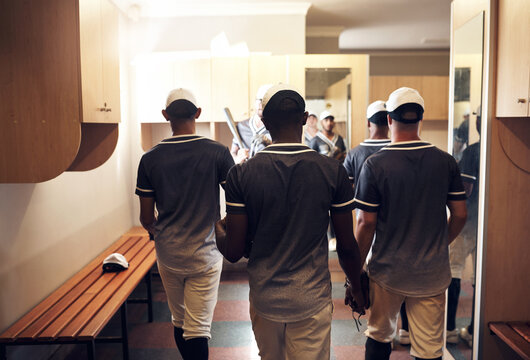 Baseball, team and back for rest in locker room, tournament and walk to half time for games. Support, unity and group of player or male people for sports, break and club for competition together - Powered by Adobe