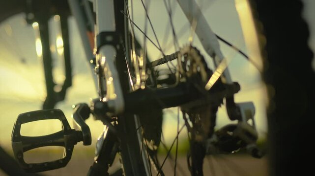 Sport. A tourist outdoors concentrates using a multitool tool to repair a bicycle on the street. Steady camera movement active man cycling lover doing bike rides, road
