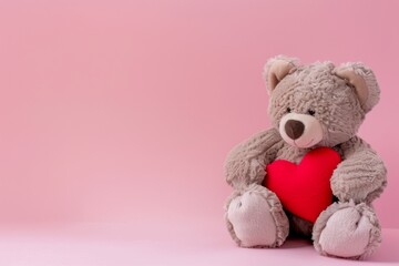 A Plush Teddy Bear Holding a Heart on a Pink Background