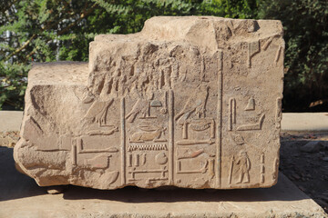 Ancient egyptian hieroglyphs carved on the walls of Satet temple in Aswan, Egypt 