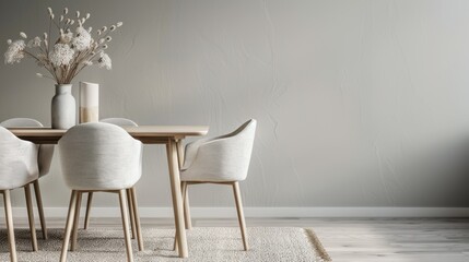 This image depicts an elegant dining room with a minimalistic design, featuring neutral-colored chairs, a wooden table, and a decorative vase with flowers to accent the space.