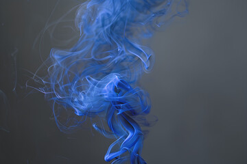 Abstract Blue Smoke Swirls on Dark Grey Background