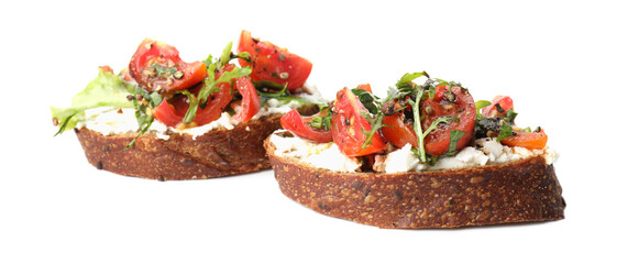Delicious bruschettas with ricotta cheese, tomatoes and arugula isolated on white