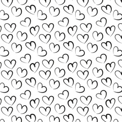 Wallpaper Seamless pattern with hand drawn ink black hearts. Cute black and white background. 