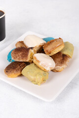 Assorted Eclairs in Vibrant Colors: A Delightful and Colorful Pastry Display