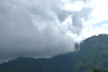 Fototapeta premium landscape of mountain with rain cloud and mist at Sai Thong water reservoir lake in Thailand