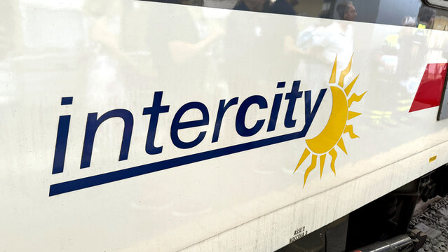 Side view of a Trenitalia Intercity train in an Italian railway station