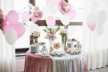 Sweet table. A plates with cakes. Table with sweets, buffet. Dessert table for a party goodies. Party reception, decorated delicious in restaurant. Candy bar