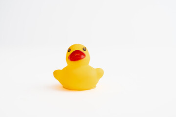 small yellow childs rubber duck for bathtime play isolated on a white background