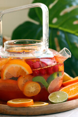 citrus tea with fresh fruits and berries
