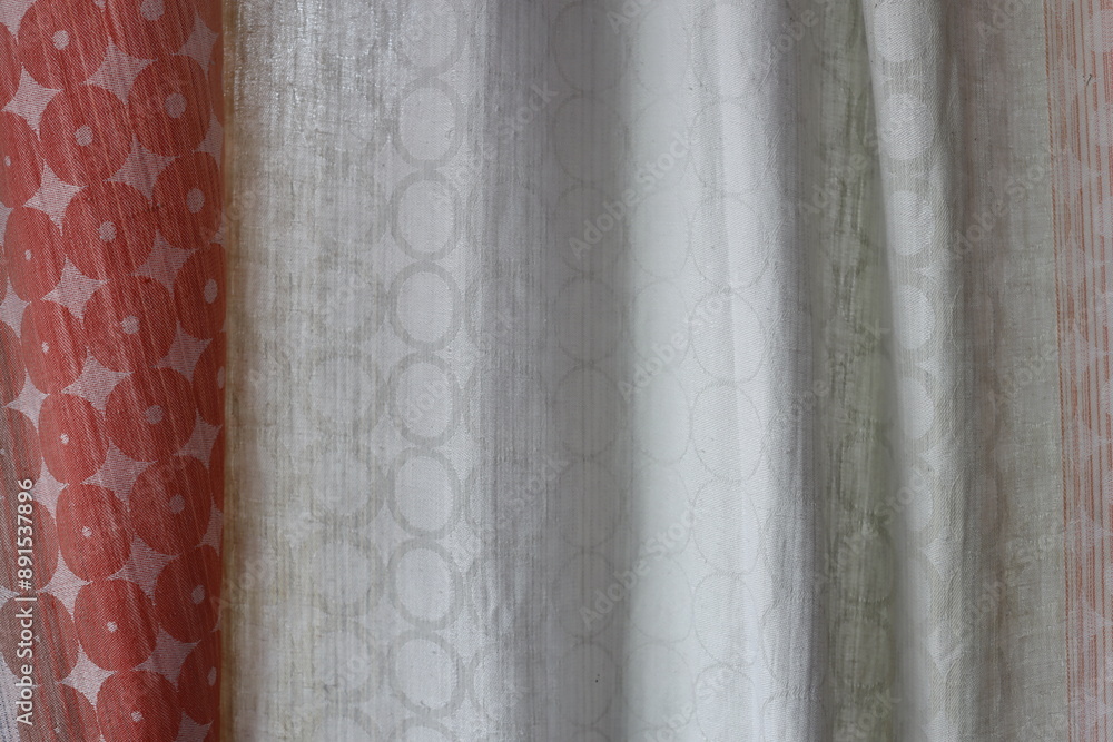 Poster Close-up view of a curtain with various patterns and textures.