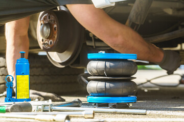 Car in service. Installing air ride suspension.