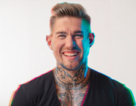 Vibrant Glitch Art of Tattooed Man Giggling in Studio with High-Contrast Effects