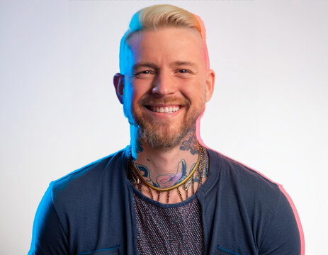 Vibrant Glitch Art of Tattooed Man Giggling in Studio with High-Contrast Effects