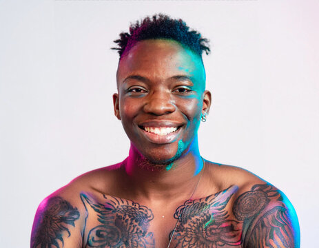 Vibrant Glitch Art of Tattooed Man Giggling in Studio with High-Contrast Effects