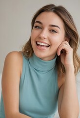 Fototapeta premium Portrait of a young woman laughing, smiling girl