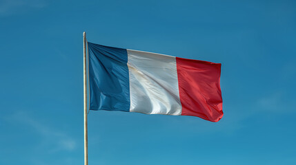 French National Flag Waving Against Clear Blue Sky on a Sunny Day