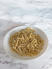 Lorighittas, ancient traditional Sardinian pasta, refined, hand-woven spaghetti made of semolina...