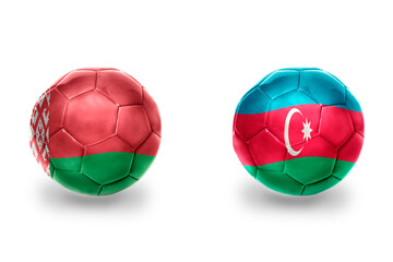 football balls with national flags of azerbaijan and belarus, soccer teams. on the white background.