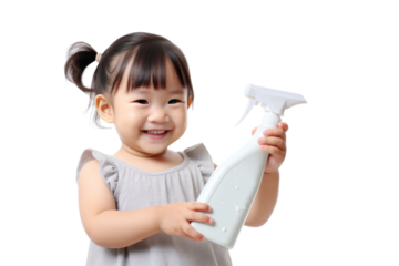 Young Asian housewife smiling while holding cleaning spray and cloth isolated on white background