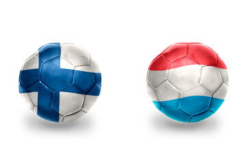 Fototapeta premium football balls with national flags of luxembourg and finland, soccer teams. on the white background.