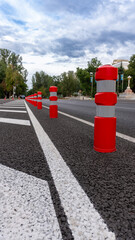 red-orange road barrier with reflective elements
