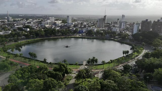 Drone orbits to left around Parque da Lagoa - Solon de Lucena on late afternoon in Joao Pessoa, Brazil